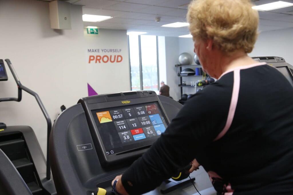 Elderly gym user using Technogym treadmill in Xcel Leisure Centre