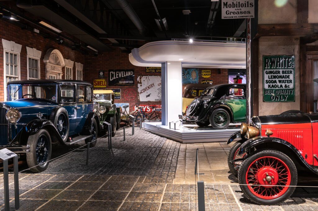 Old style cars feature in a room at Coventry Transport Museum. Photographed by @garryjonesphotography