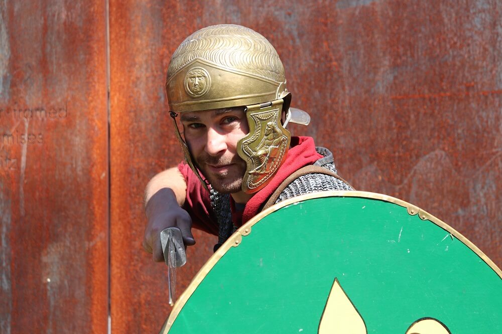 Man in roman costume at Lunt Roman Fort