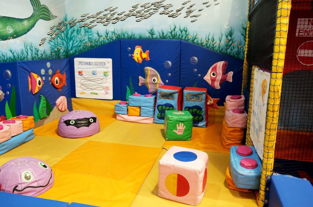 Inside Centre AT7 Creche play area colourful soft play flooring and shapes