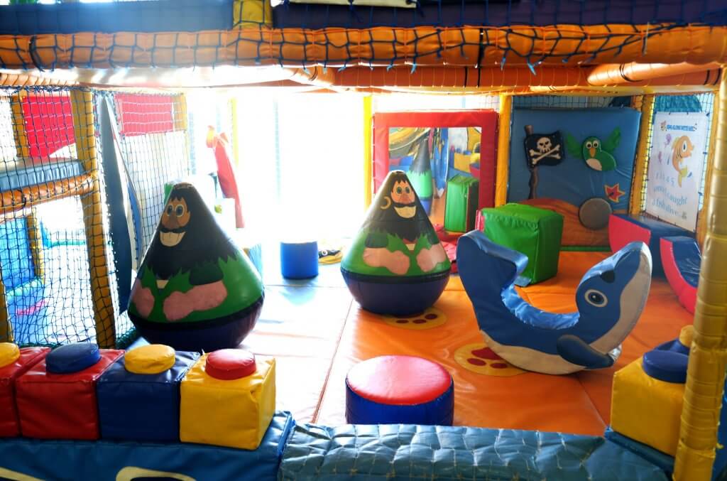 Inside Xcel Leisure Centre Creche play area colourful soft play flooring.